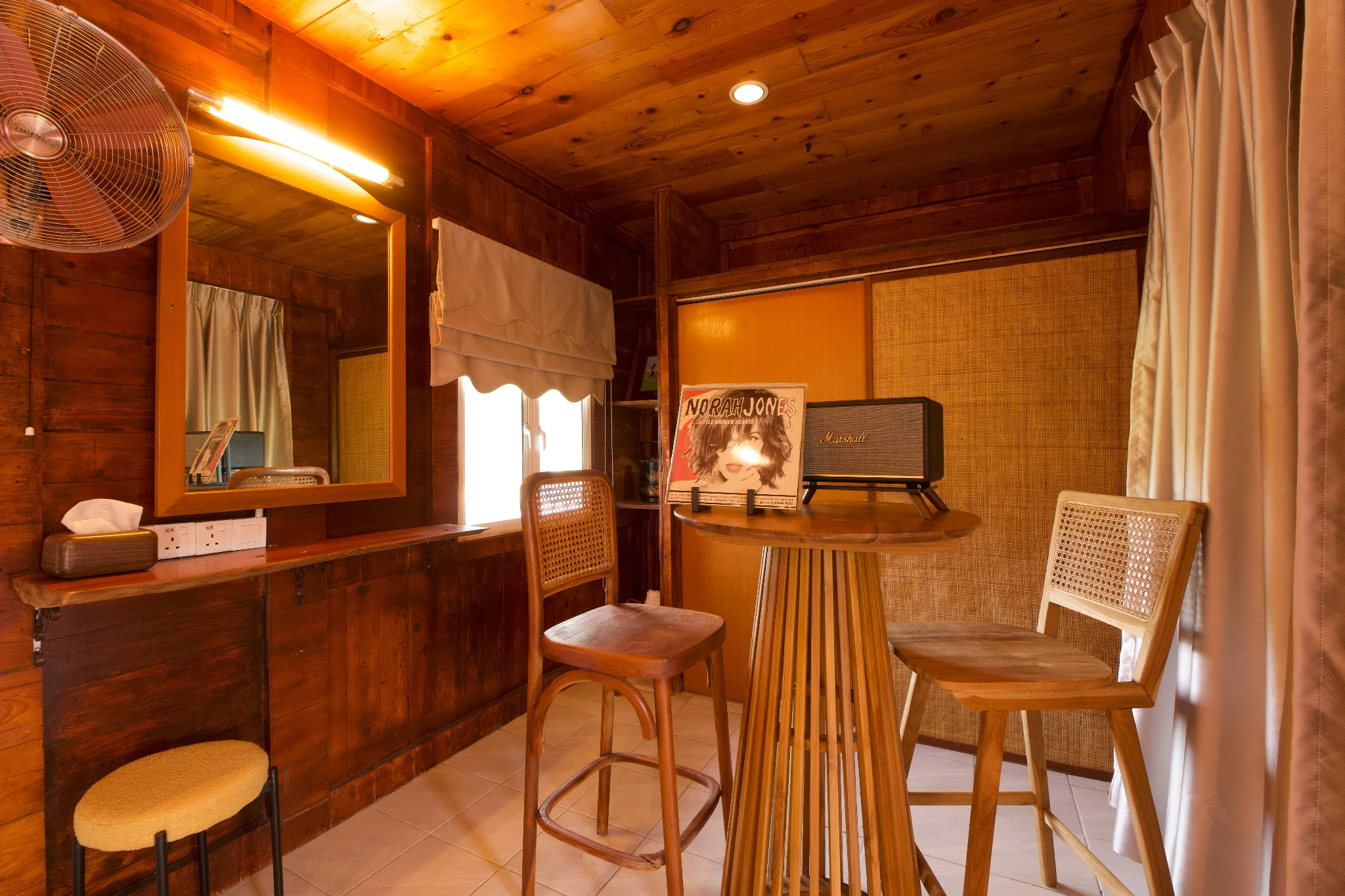 Rumah Teduh Langkawi – Vintage Coffee Corner Vintage coffee corner at Rumah Teduh Langkawi with wooden interiors, rattan chairs, Marshall speaker and vinyl record